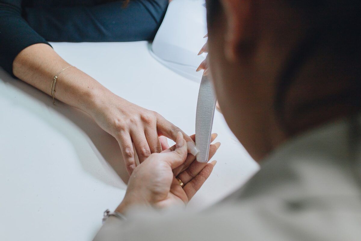 Nails filed and shaped during a manicure