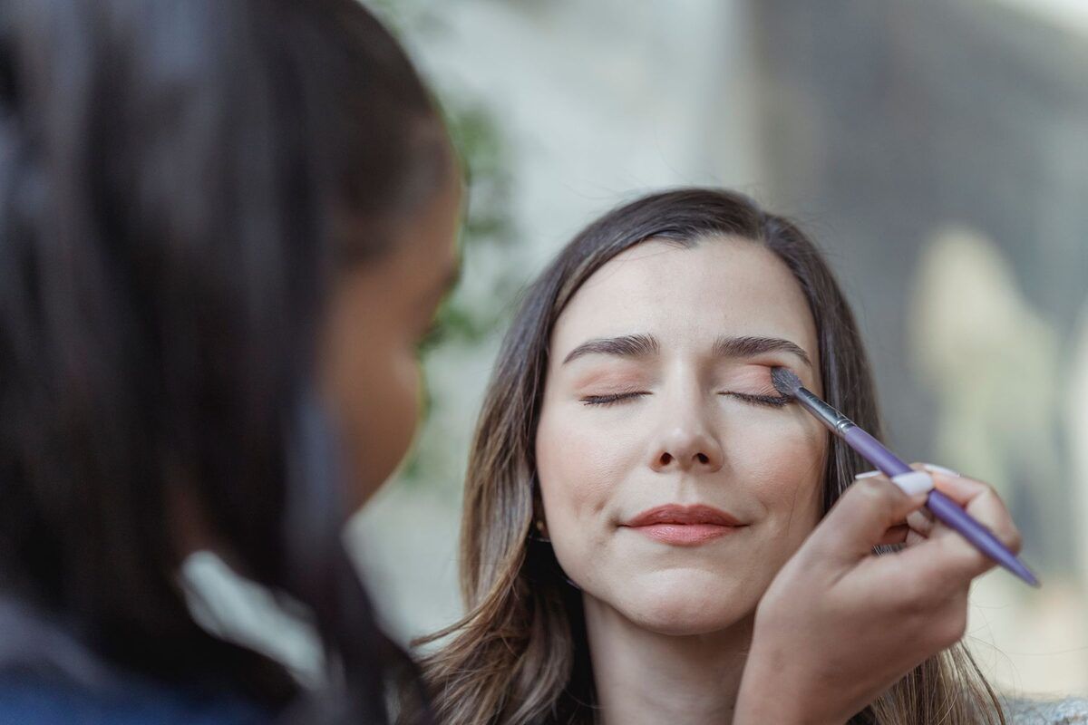 Eyeshadow applied with a brush during a makeup session