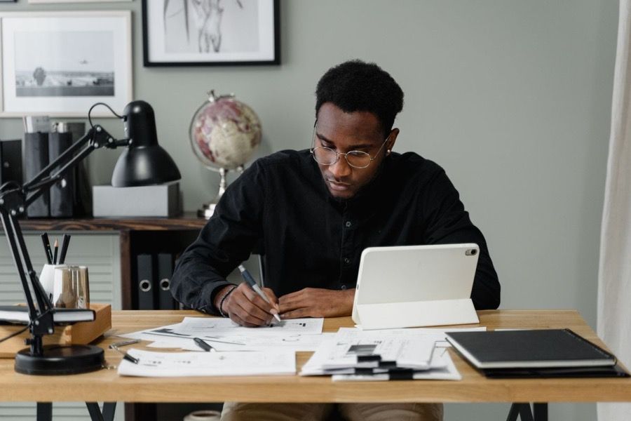 A provider filling in paperwork at their desk